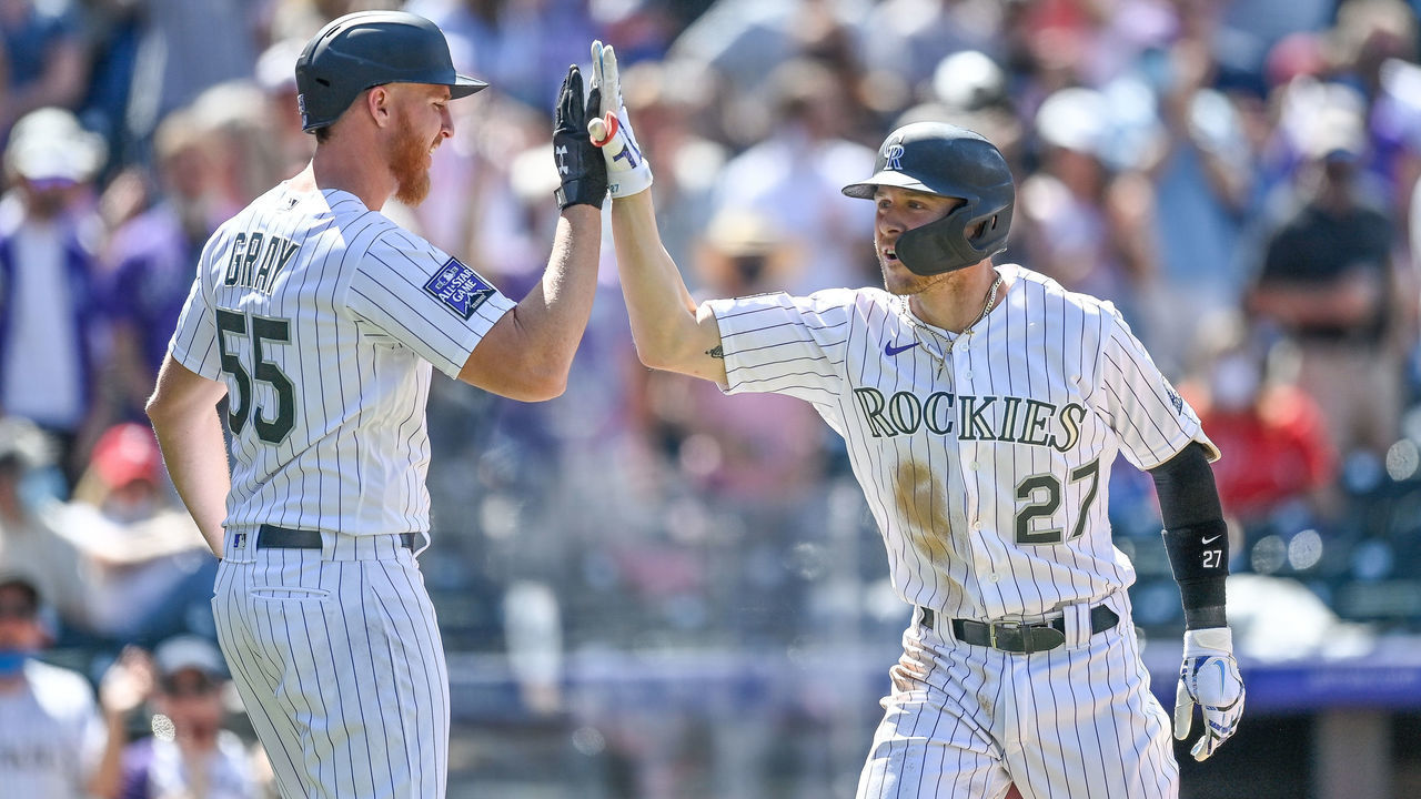DENVER, CO - APRIL 25: Colorado Rockies shortstop Trevor Story (27) is congratulated by starting pitcher Jon Gray (55) after hitting a fourth inning grand slam homerun during a game between the Colorado Rockies and the Philadelphia Phillies at Coors Field in Denver, Colorado on April 25, 2021.
