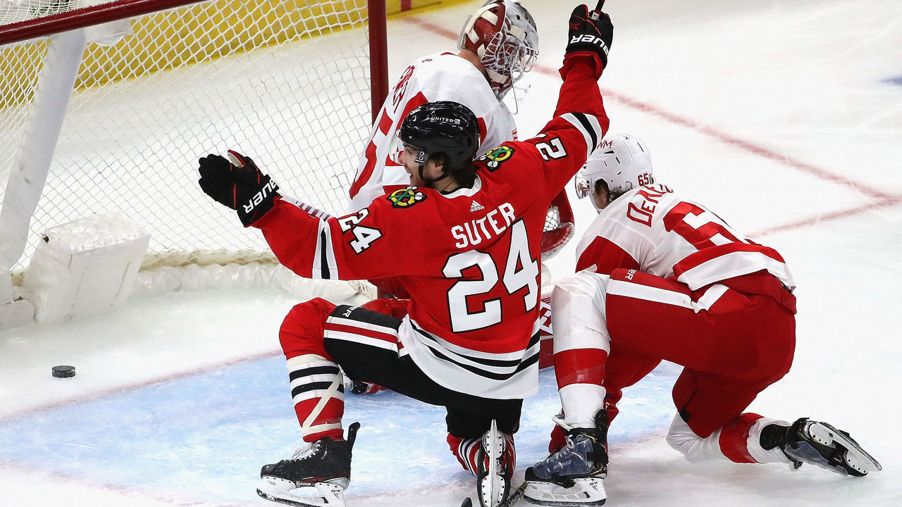 CHICAGO, ILLINOIS - JANUARY 24: Pius Suter #24 of the Chicago Blackhawks celebrates his second goal of the first period against the Detroit Red Wings at the United Center on January 24, 2021 in Chicago, Illinois.