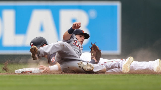MINNEAPOLIS, MN - JULY 28: Jake Cave #60 of the Minnesota Twins is caught trying to steal second base by Zack Short #59 of the Detroit Tigers in the eighth inning of the game at Target Field on July 28, 2021 in Minneapolis, Minnesota. The Tigers defeated the Twins 17-14.