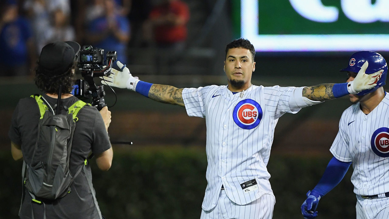CHICAGO, ILLINOIS - JULY 26: Javier Baez #9 of the Chicago Cubs reacts after his walk off single in the ninth inning against the Cincinnati Reds at Wrigley Field on July 26, 2021 in Chicago, Illinois.