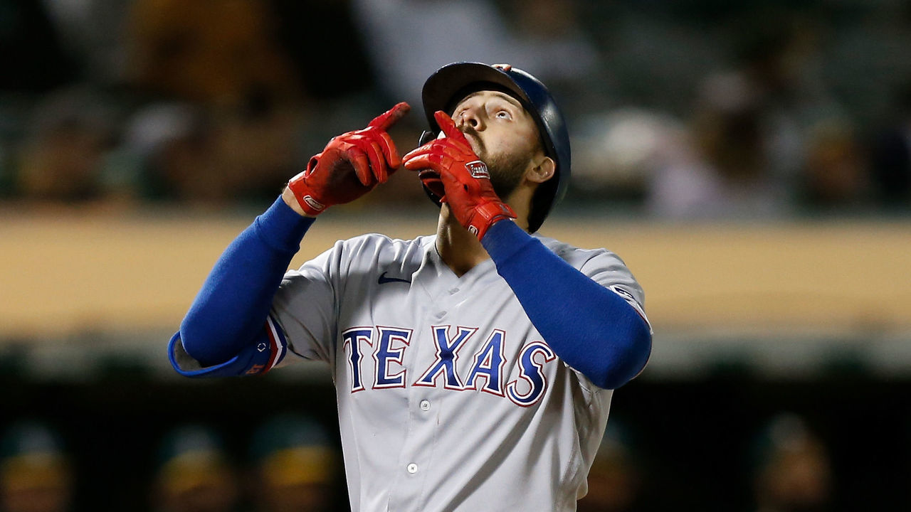 OAKLAND, CALIFORNIA - JUNE 30: Joey Gallo #13 of the Texas Rangers celebrates as he crosses home plate after hitting a solo home run in the top of the ninth inning against the Oakland Athletics at RingCentral Coliseum on June 30, 2021 in Oakland, California.