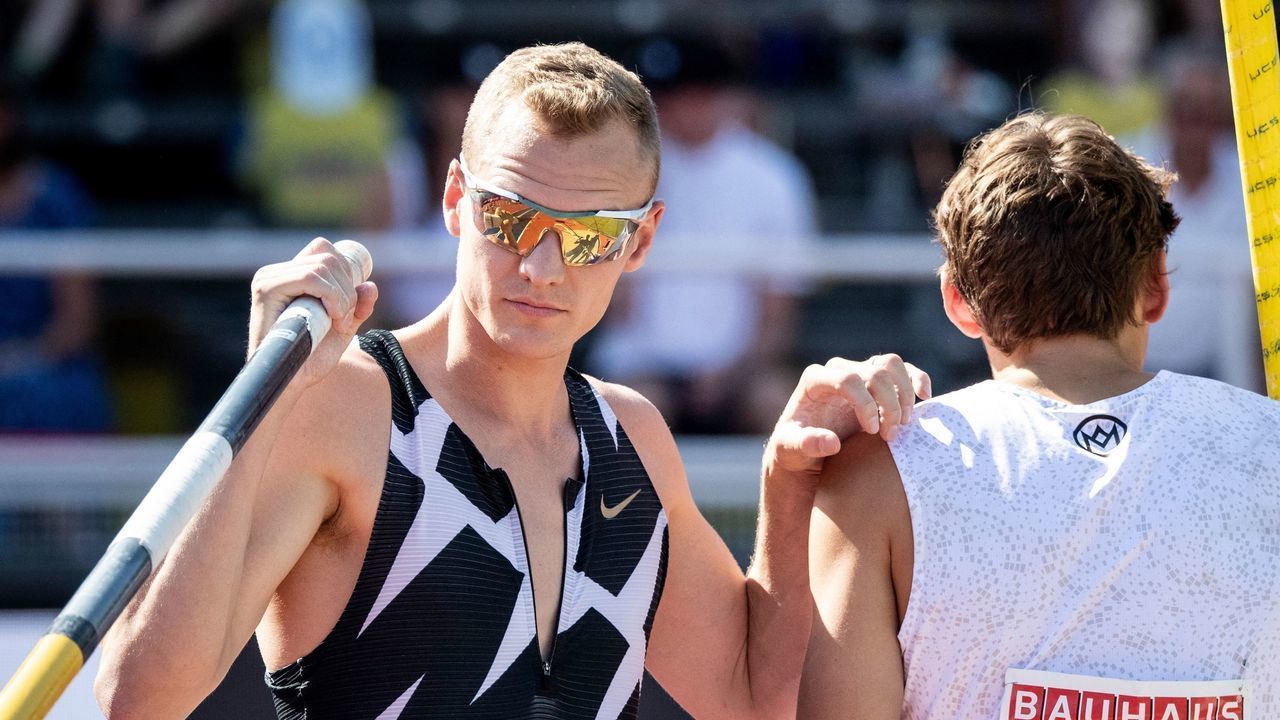 Sam Kendricks (L) of the US and Sweden's Armand Duplantis compete in the men's final pole vault event during the Diamond League Track and Field meeting in Stockholm, on July 4, 2021. - Sweden OUT