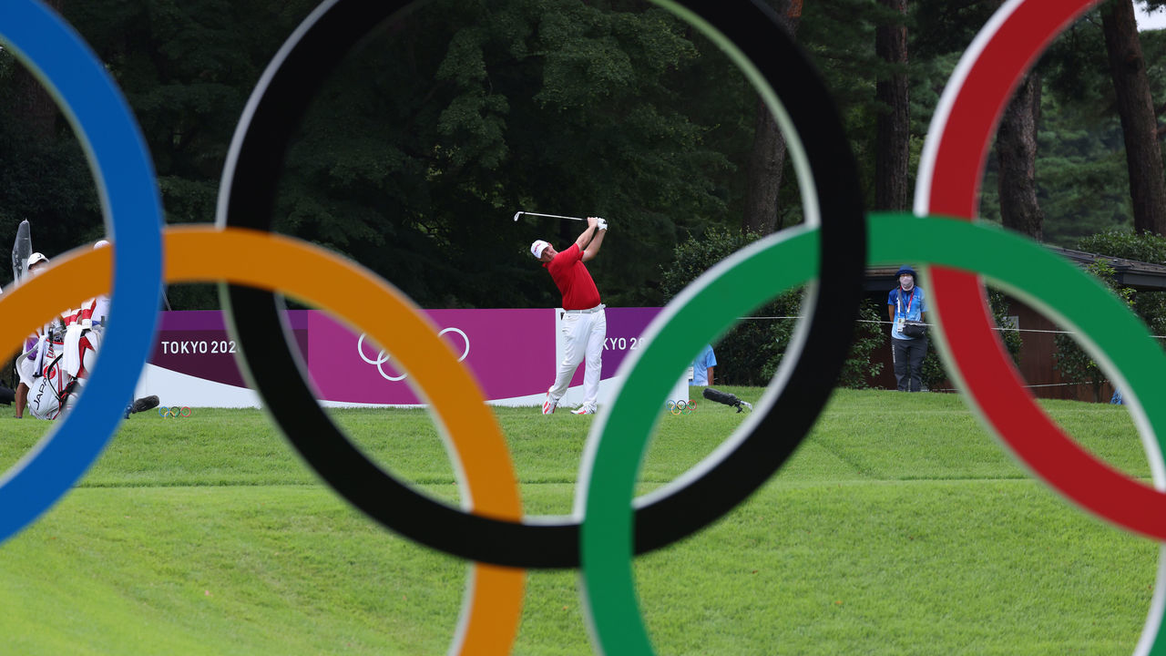 KAWAGOE, JAPAN - JULY 29: Sepp Straka of Team Austria plays his shot from the 16th tee as seen through Olympic rings during the first round of the Men's Individual Stroke Play on day six of the Tokyo 2020 Olympic Games at Kasumigaseki Country Club on July 29, 2021 in Kawagoe, Saitama, Japan.