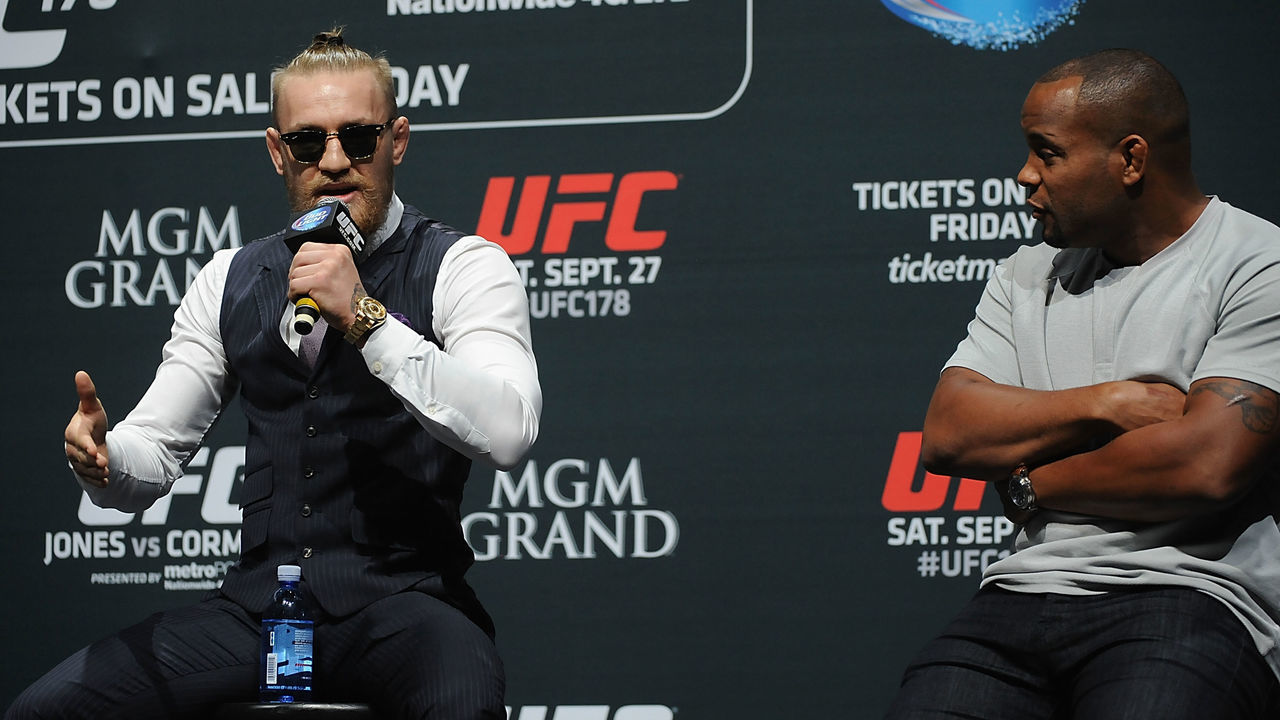 LOS ANGELES, CA - AUGUST 05: (L-R) Mixed martial artist Conor McGregor of Ireland and Daniel Cormier talk during a UFC Q&A at LA Live on August 5, 2014 in Los Angeles, California.