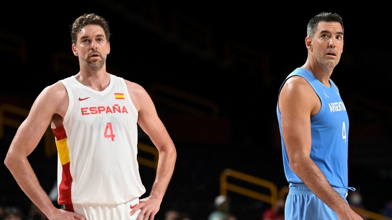 Spain's Pau Gasol Saez (L) and Argentina's Luis Scola look on during the men's preliminary round group C basketball match between Spain and Argentina during the Tokyo 2020 Olympic Games at the Saitama Super Arena in Saitama on July 29, 2021.