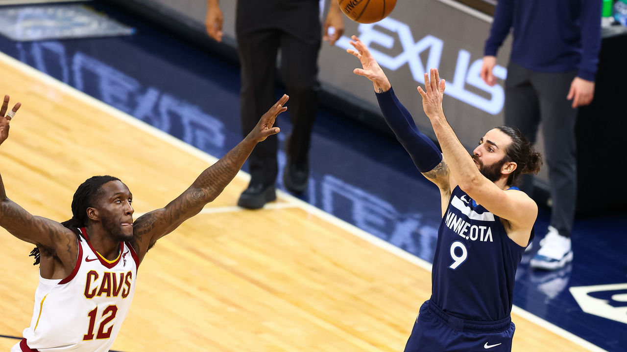 MINNEAPOLIS, MN - JANUARY 31: Ricky Rubio #9 of the Minnesota Timberwolves shoots the ball over Taurean Prince #12 of the Cleveland Cavaliers during the second quarter at Target Center on January 31, 2021 in Minneapolis, Minnesota.
