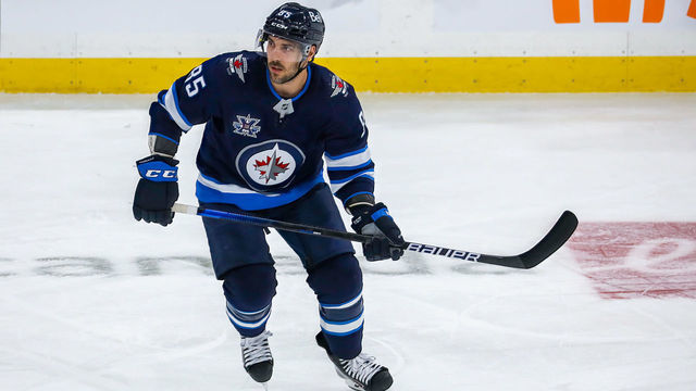 WINNIPEG, MB - MAY 24: Mathieu Perreault #85 of the Winnipeg Jets keeps an eye on the play during action in the first overtime period against the Edmonton Oilers in Game Four of the First Round of the 2021 Stanley Cup Playoffs at Bell MTS Place on May 24, 2021 in Winnipeg, Manitoba.