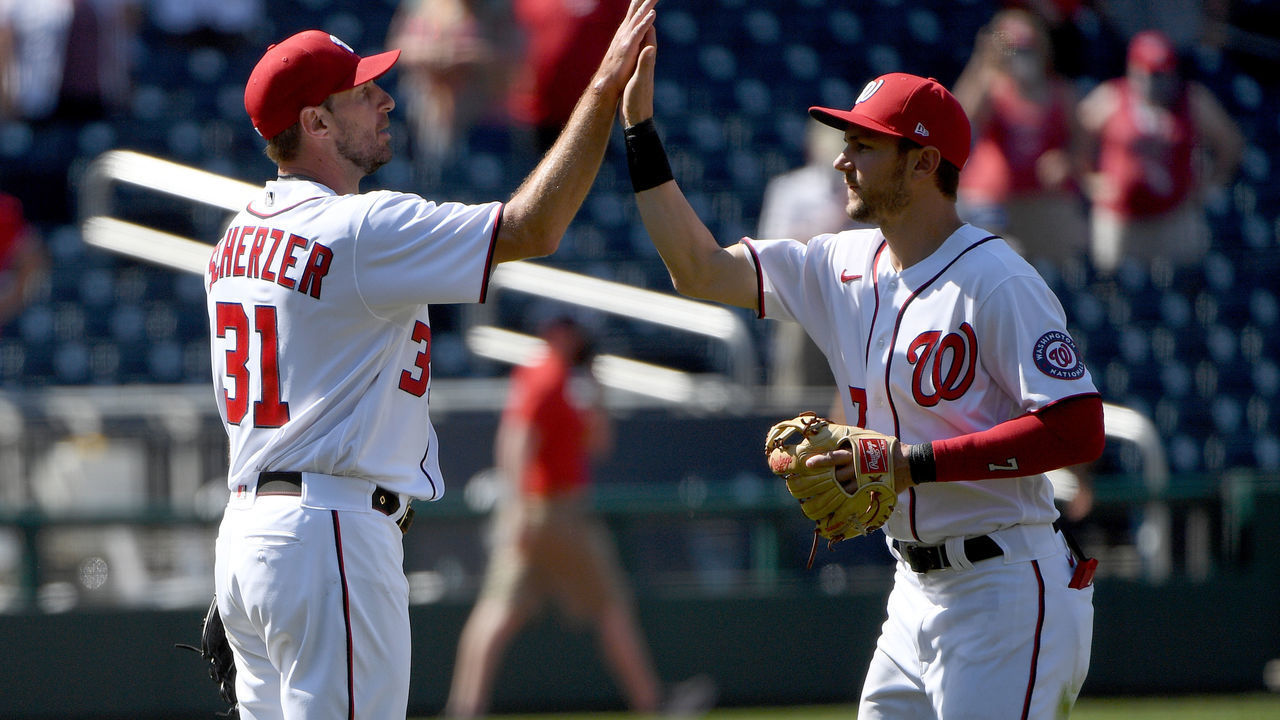 WASHINGTON, DC - MAY 02: Max Scherzer #31 of the Washington Nationals celebrates with Trea Turner #7 after throwing a complete game against the Miami Marlins at Nationals Park on May 02, 2021 in Washington, DC.