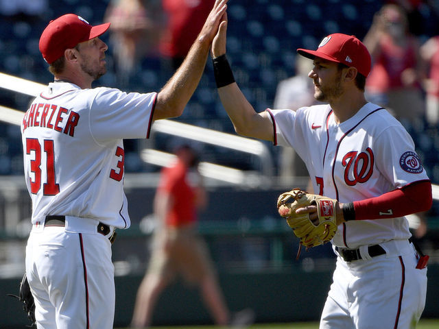 WASHINGTON, DC - MAY 02: Max Scherzer #31 of the Washington Nationals celebrates with Trea Turner #7 after throwing a complete game against the Miami Marlins at Nationals Park on May 02, 2021 in Washington, DC.