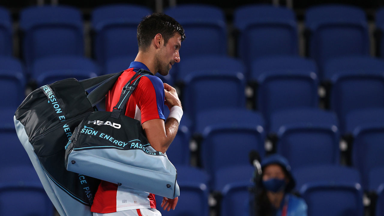 TOKYO, JAPAN - JULY 30: Novak Djokovic of Team Serbia makes his way off court after defeat in his Men's Singles Semifinal match against Alexander Zverev of Team Germany on day seven of the Tokyo 2020 Olympic Games at Ariake Tennis Park on July 30, 2021 in Tokyo, Japan.