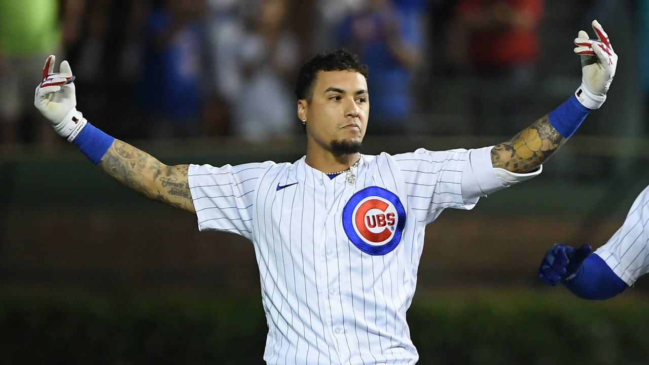 CHICAGO, ILLINOIS - JULY 26: Javier Baez #9 of the Chicago Cubs reacts after his walk off single in the ninth inning against the Cincinnati Reds at Wrigley Field on July 26, 2021 in Chicago, Illinois.