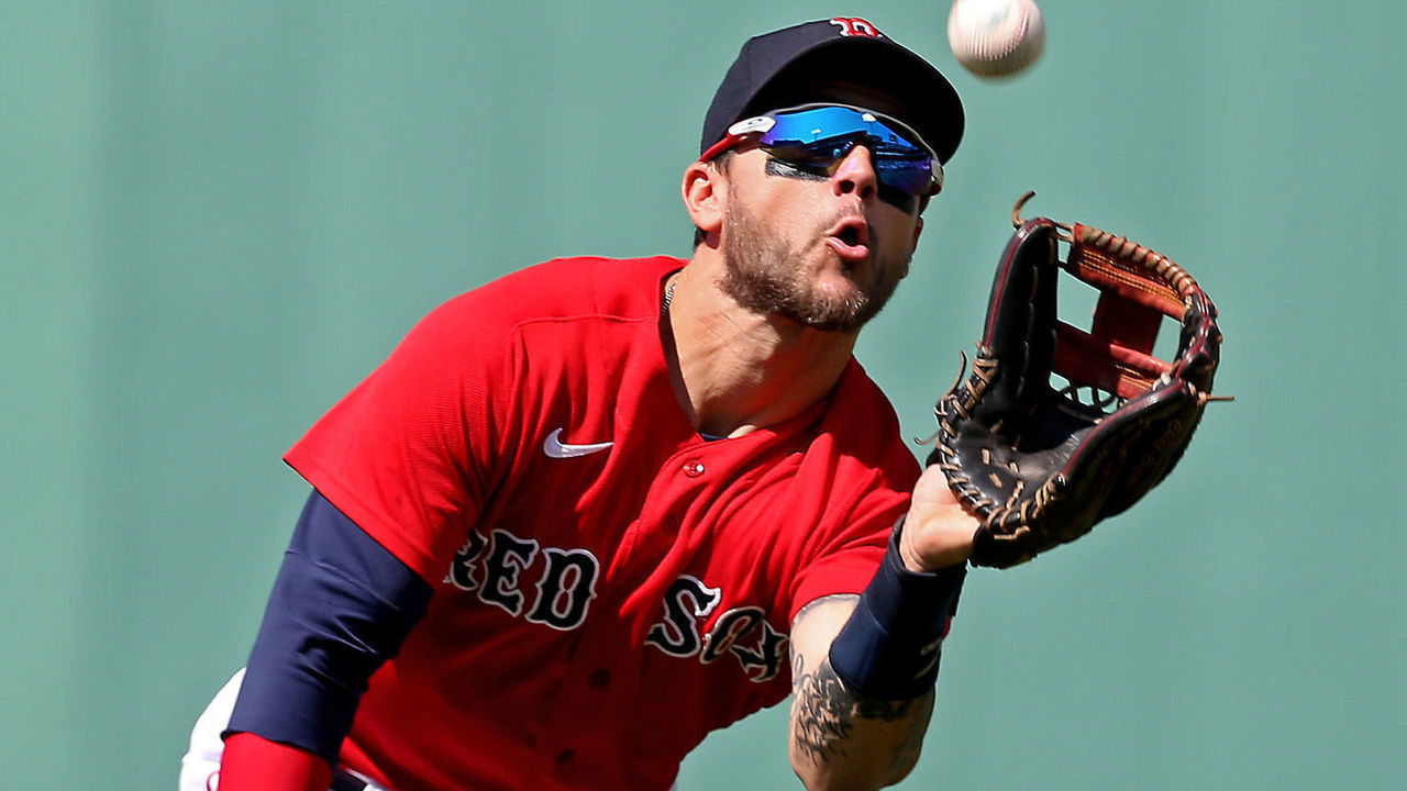 BOSTON, MA - July 28: Michael Chavis #23 of the Boston Red Sox catches Vladimir Guerrero Jr. #27 of the Toronto Blue Jays pop out during the third inning of the MLB game at Fenway Park on July 28, 2021 in Boston, Massachusetts.