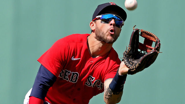 BOSTON, MA - July 28: Michael Chavis #23 of the Boston Red Sox catches Vladimir Guerrero Jr. #27 of the Toronto Blue Jays pop out during the third inning of the MLB game at Fenway Park on July 28, 2021 in Boston, Massachusetts.