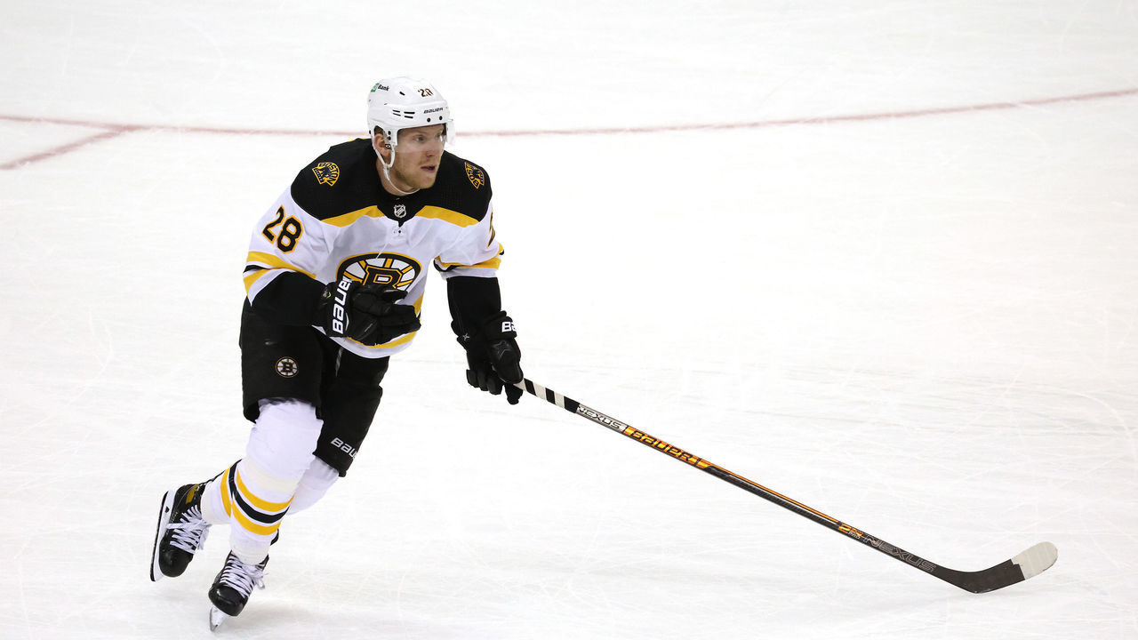 NEWARK, NEW JERSEY - JANUARY 14: Ondrej Kase #28 of the Boston Bruins takes the puck against the New Jersey Devils during the home opening game at Prudential Center on January 14, 2021 in Newark, New Jersey. The Boston Bruins defeated the New Jersey Devils 3-2 in a shootout.