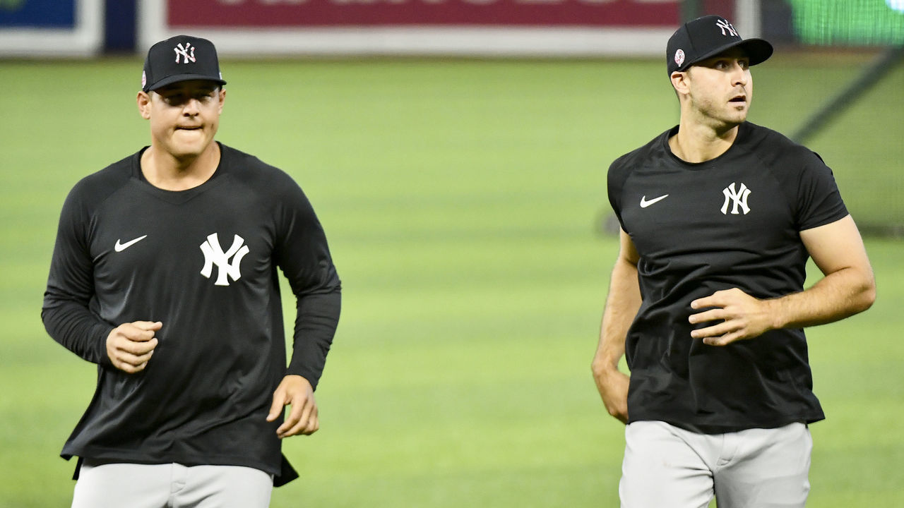 MIAMI, FL - JULY 30: Anthony Rizzo #48 and Joey Gallo #13 of the New York Yankees warm up before the game against the Miami Marlins at loanDepot park on July 30, 2021 in Miami, Florida.