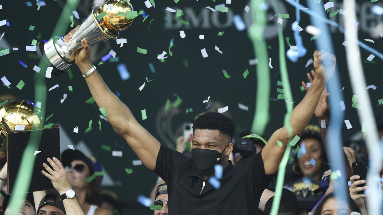 MILWAUKEE, WISCONSIN - JULY 22: Giannis Antetokounmpo celebrates with the Larry O'Brien trophy during the Milwaukee Bucks 2021 NBA Championship Victory Parade and Rally in the Deer District of Fiserv Forum on July 22, 2021 in Milwaukee, Wisconsin.