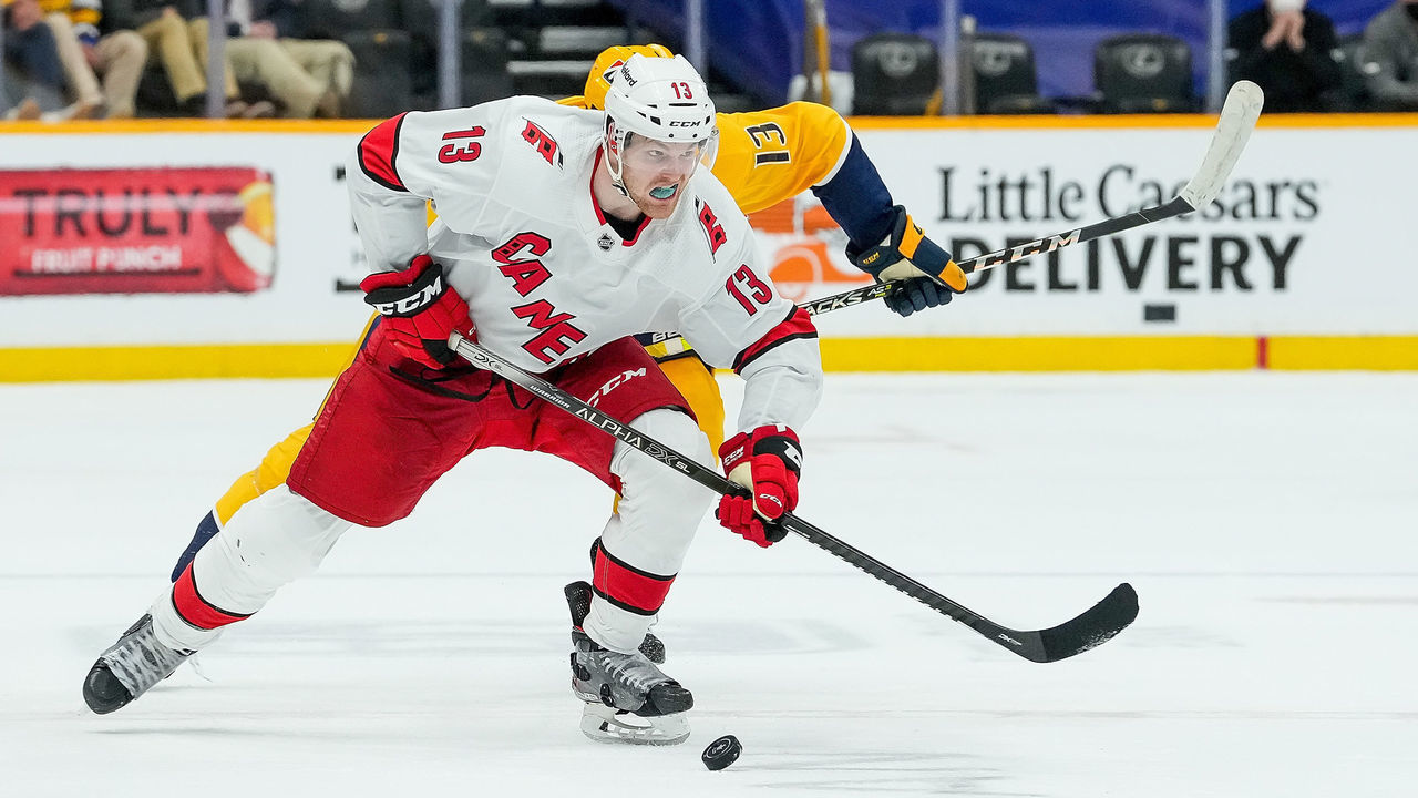 NASHVILLE, TN - MAY 27: Warren Foegele #13 of the Carolina Hurricanes skates against the Nashville Predators in Game Six of the First Round of the 2021 Stanley Cup Playoffs at Bridgestone Arena on May 27, 2021 in Nashville, Tennessee.