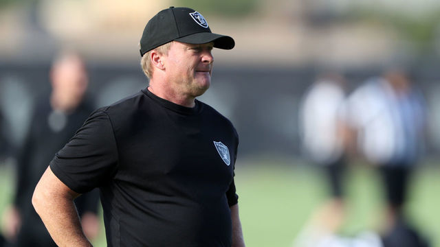 HENDERSON, NEVADA - JULY 28: Head coach Jon Gruden of the Las Vegas Raiders watches players warm up during training camp at the Las Vegas Raiders Headquarters/Intermountain Healthcare Performance Center on July 28, 2021 in Henderson, Nevada.
