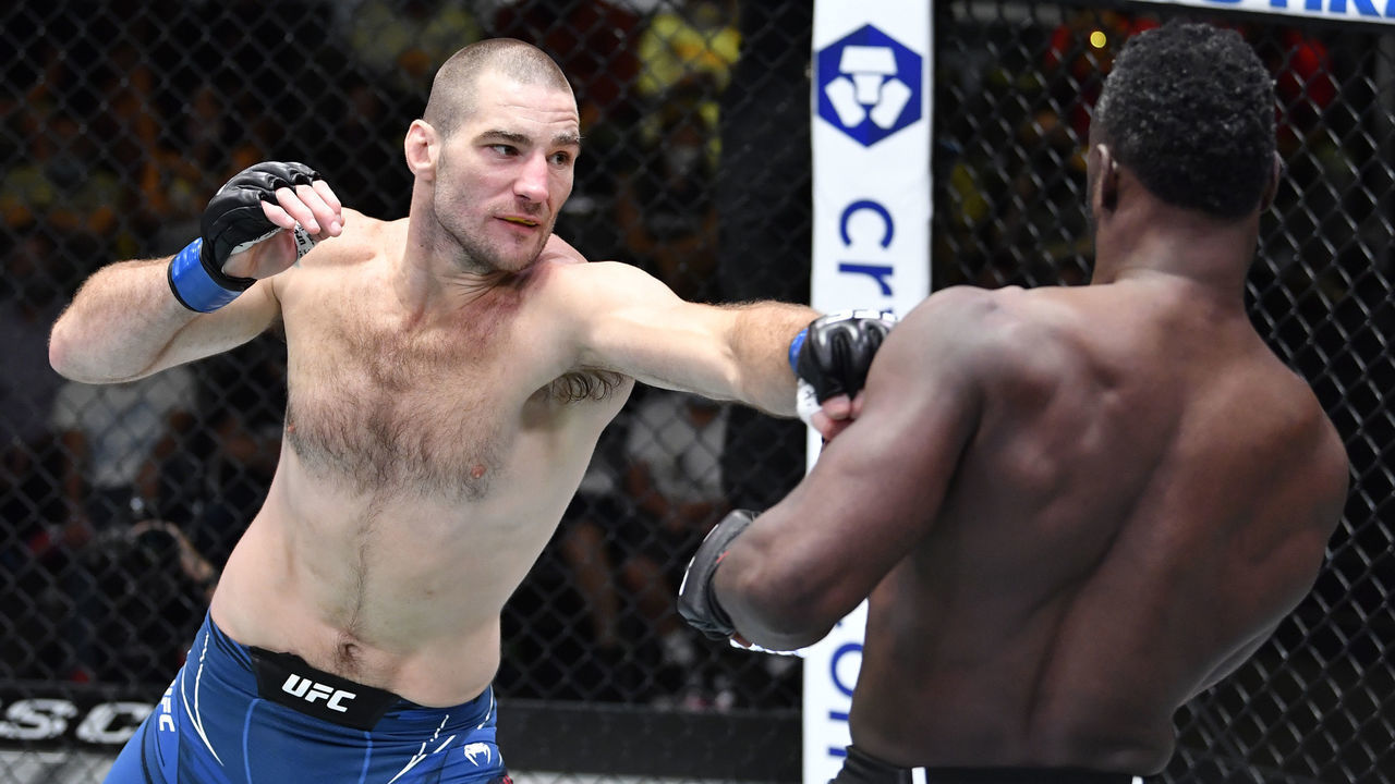 LAS VEGAS, NEVADA - JULY 31: (L-R) Sean Strickland punches Uriah Hall of Jamaica in a middleweight fight during the UFC Fight Night event at UFC APEX on July 31, 2021 in Las Vegas, Nevada.