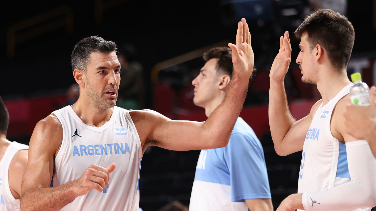 SAITAMA, JAPAN - AUGUST 01: Luis Scola #4 of Team Argentina celebrates with teammates on the bench against Japan during the second half of a Men's Basketball Preliminary Round Group C game at Saitama Super Arena on August 01, 2021 in Saitama, Japan.
