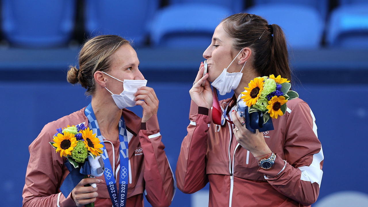 TOKYO, JAPAN - AUGUST 01: (L-R) Silver Medalists Viktorija Golubic of Team Switzerland and Belinda Bencic of Team Switzerland pose on the podium during the medal ceremony for Tennis Women's Doubles on day nine of the Tokyo 2020 Olympic Games at Ariake Tennis Park on August 01, 2021 in Tokyo, Japan.