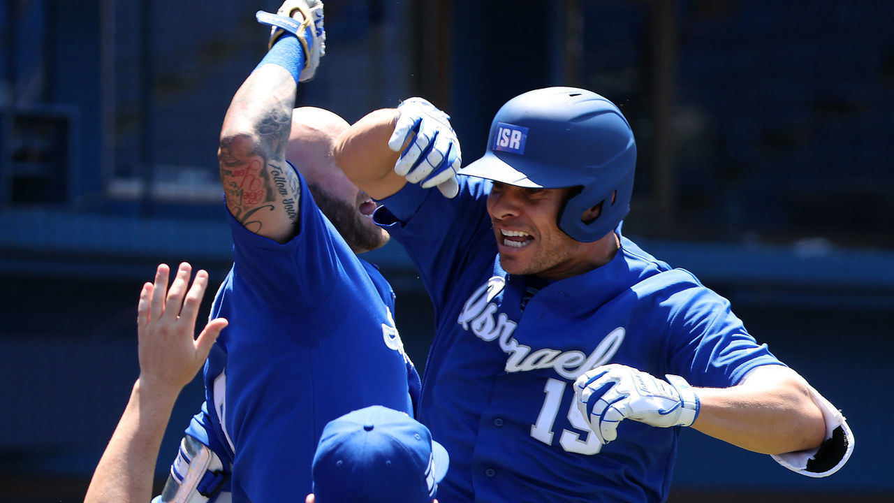 YOKOHAMA, JAPAN - AUGUST 01: Daniel Valencia #19 of Team Israel celebrates with teammates in the dugout after Valencia hit a three-run home run to left field in the third inning against pitcher Manuel Barreda #50 of Team Mexico during round one of baseball team competition on day nine of the Tokyo 2020 Olympic Games at Yokohama Baseball Stadium on August 01, 2021 in Yokohama, Kanagawa, Japan.