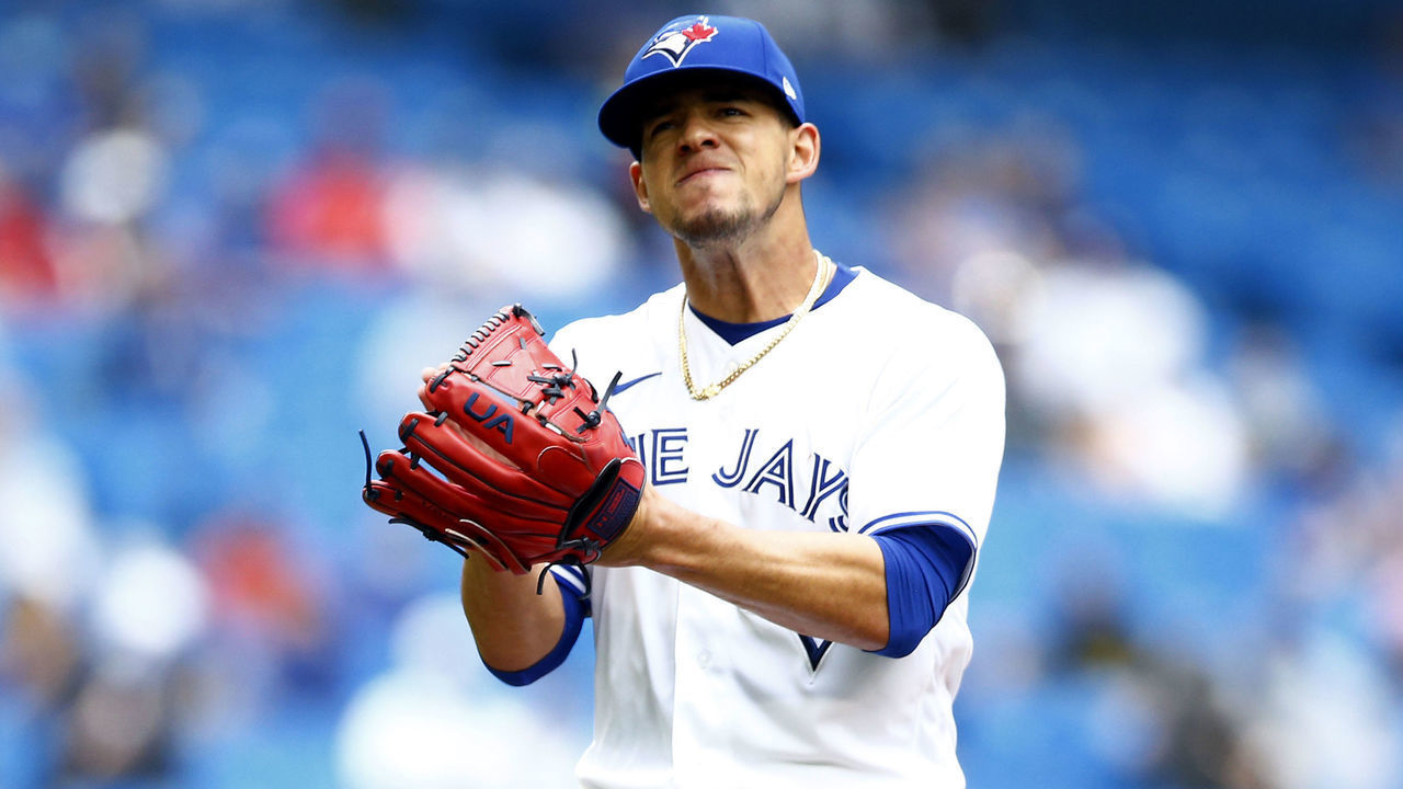 TORONTO, ON - AUGUST 01: Jose Berrios #17 of the Toronto Blue Jays slaps his glove at the end of the second inning during a MLB game against the Kansas City Royals at Rogers Centre on August 01, 2021 in Toronto, Canada.