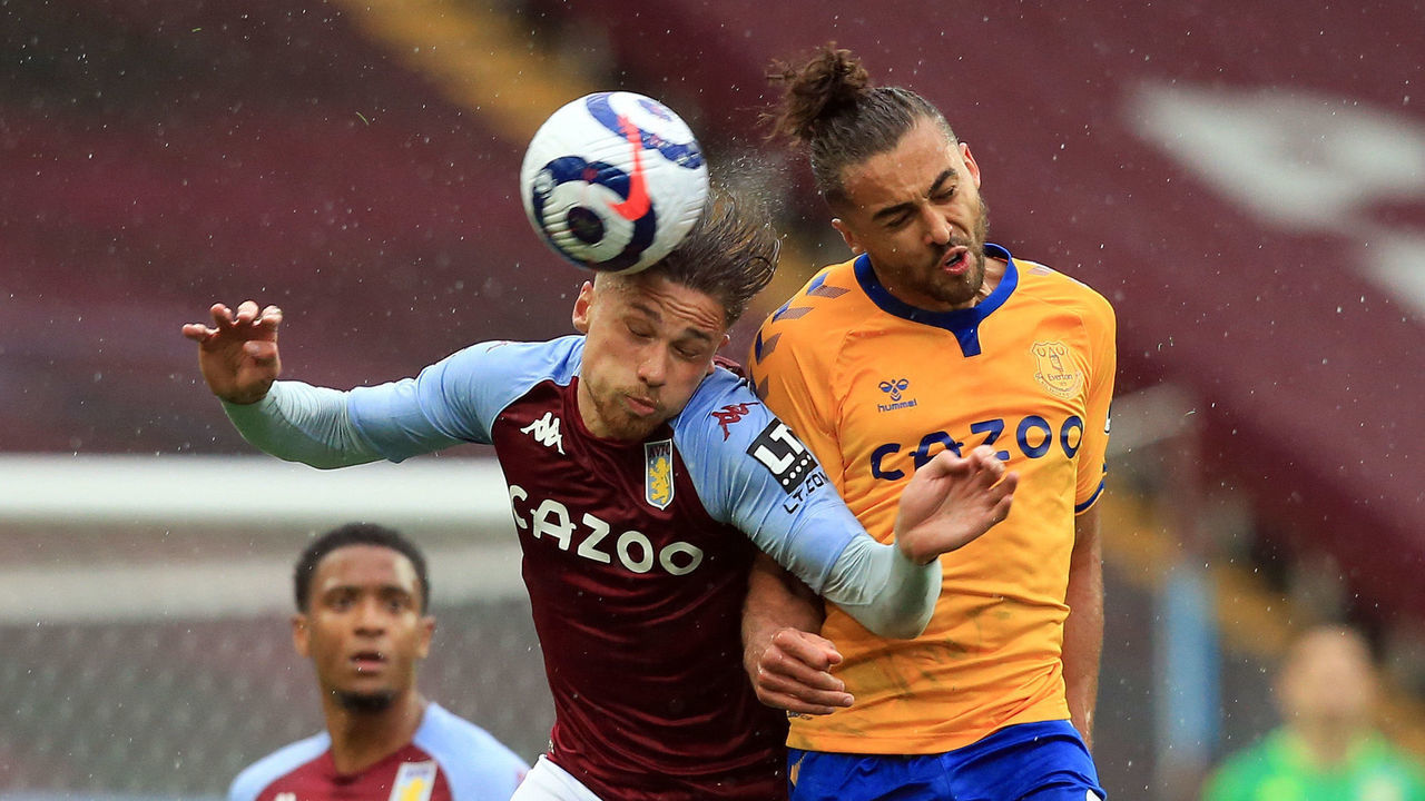 BIRMINGHAM, ENGLAND - MAY 13: Matthew Cash of Aston Villa competes for a header with Dominic Calvert-Lewin of Everton during the Premier League match between Aston Villa and Everton at Villa Park on May 13, 2021 in Birmingham, England. Sporting stadiums around England remain under strict restrictions due to the Coronavirus Pandemic as Government social distancing laws prohibit fans inside venues resulting in games being played behind closed doors.