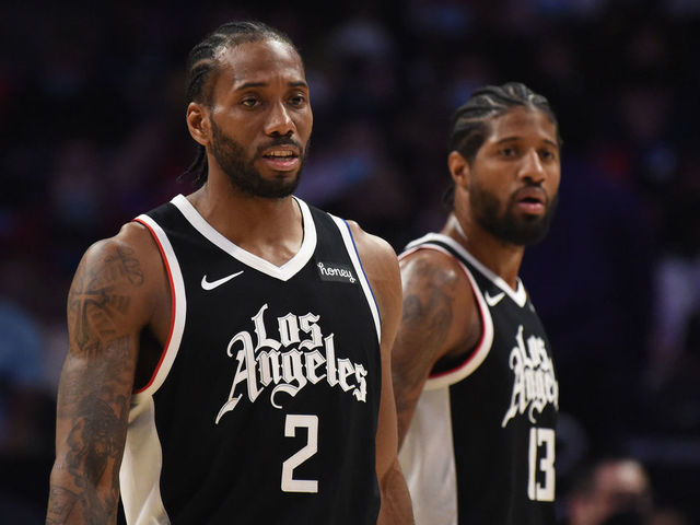 LOS ANGELES, CA - JUNE 12: Kawhi Leonard #2 of the LA Clippers and Paul George #13 of the LA Clippers looks on during Round 2, Game 3 of the 2021 NBA Playoffs on June 12, 2021 at STAPLES Center in Los Angeles, California. NOTE TO USER: User expressly acknowledges and agrees that, by downloading and/or using this Photograph, user is consenting to the terms and conditions of the Getty Images License Agreement. Mandatory Copyright Notice: Copyright 2021 NBAE