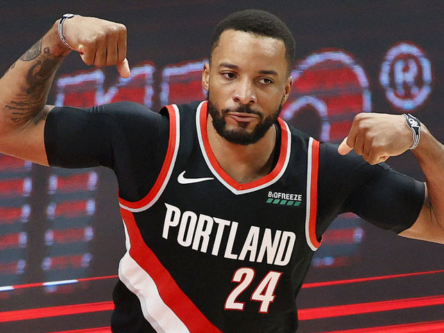 PORTLAND, OREGON - MAY 29: Norman Powell #24 of the Portland Trail Blazers flexes after his basket against Nikola Jokic #15 of the Denver Nuggets in the third quarter during Round 1, Game 4 of the 2021 NBA Playoffs at Moda Center on May 29, 2021 in Portland, Oregon.