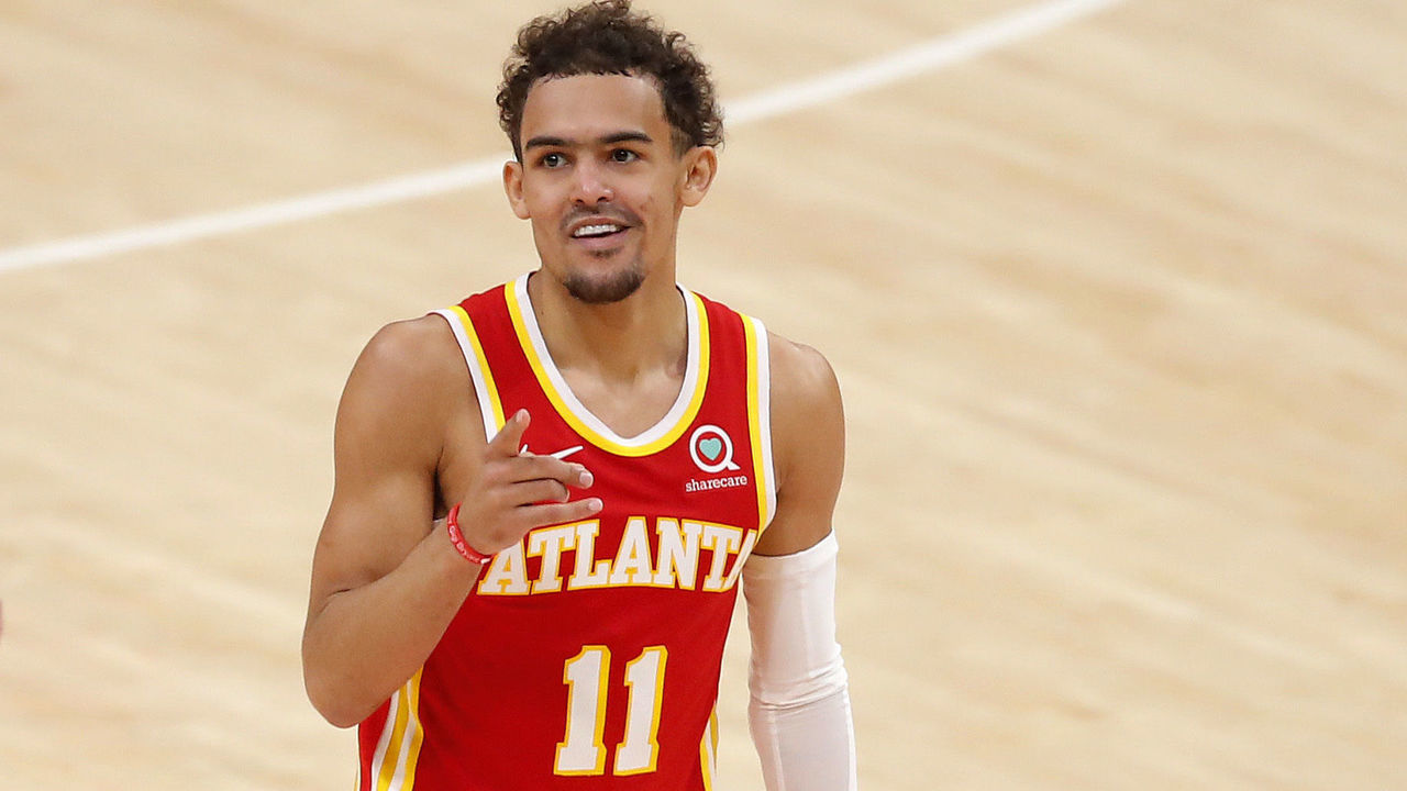 ATLANTA, GEORGIA - JUNE 27: Trae Young #11 of the Atlanta Hawks reacts after a three point basket against the Milwaukee Bucks during the first half in game three of the Eastern Conference Finals at State Farm Arena on June 27, 2021 in Atlanta, Georgia.