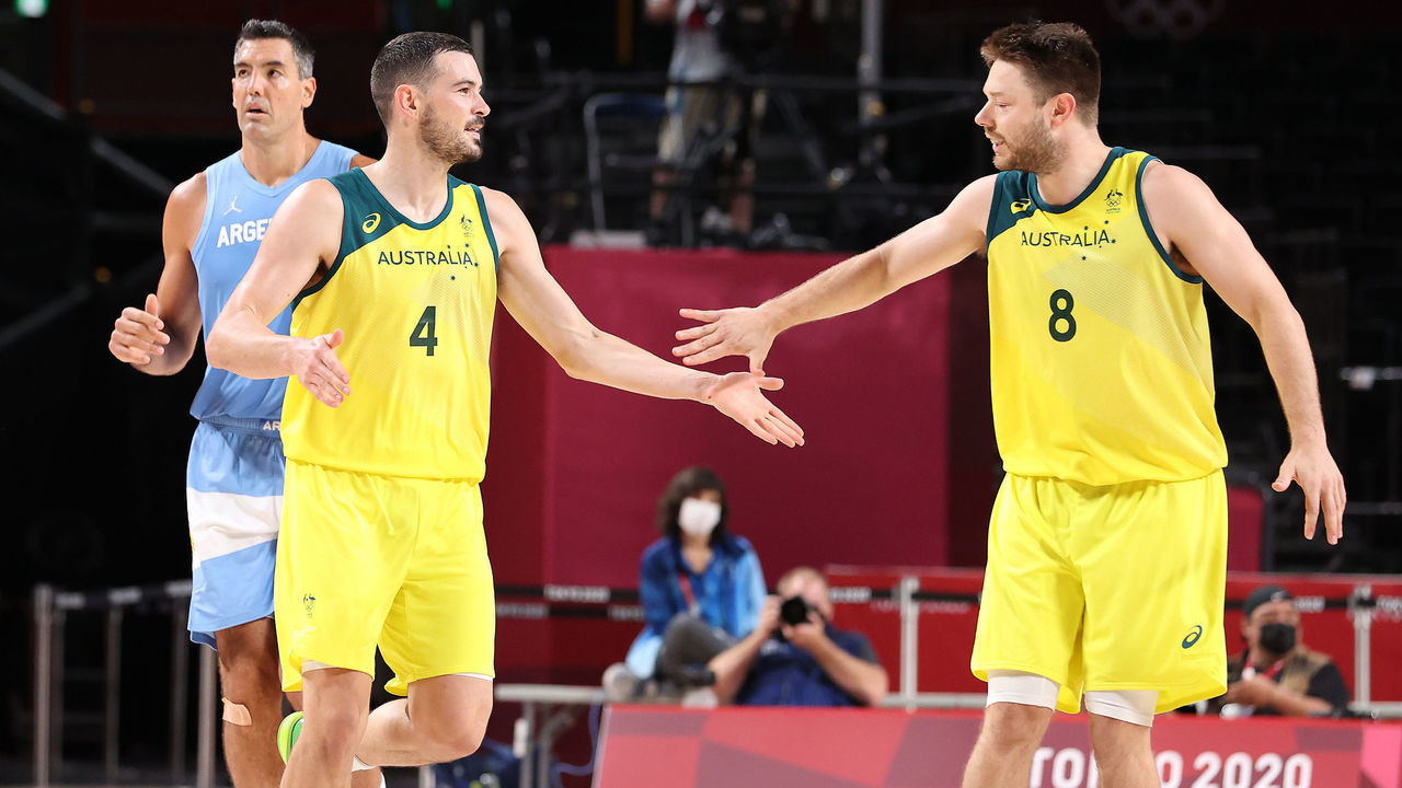 SAITAMA, JAPAN - AUGUST 03: Chris Goulding #4 of Team Australia high-fives teammate Matthew Dellavedova #8 during the second half of a Men's Basketball Quarterfinal game against Team Argentina on day eleven of the Tokyo 2020 Olympic Games at Saitama Super Arena on August 03, 2021 in Saitama, Japan.