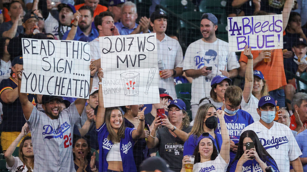 HOUSTON, TEXAS - MAY 25: Fans hold sings during the first inning of a game between the Houston Astros and the Los Angeles Dodgers at Minute Maid Park on May 25, 2021 in Houston, Texas.