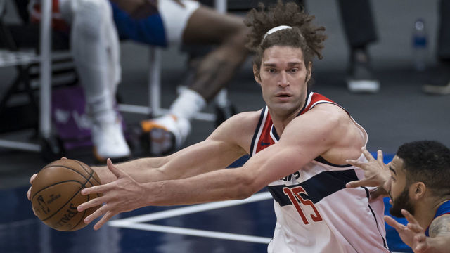 WASHINGTON, DC - APRIL 17: Robin Lopez #15 of the Washington Wizards in action against Cory Joseph #18 of the Detroit Pistons during the second half at Capital One Arena on April 17, 2021 in Washington, DC.