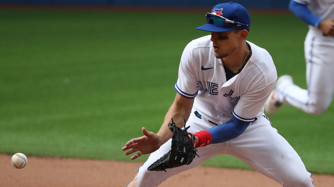 Toronto, ON- August 1 - Toronto Blue Jays first baseman Cavan Biggio (8) fields a ball in the ninth inning. Toronto Blue Jays play the Kansas City Royals to end their first home stand in Canada after playing in the USA for 670 days because of the COVID-19 pandemic at Rogers Centre in Toronto. August 1, 2021. (Steve Russell/Toronto Star via Getty Images)