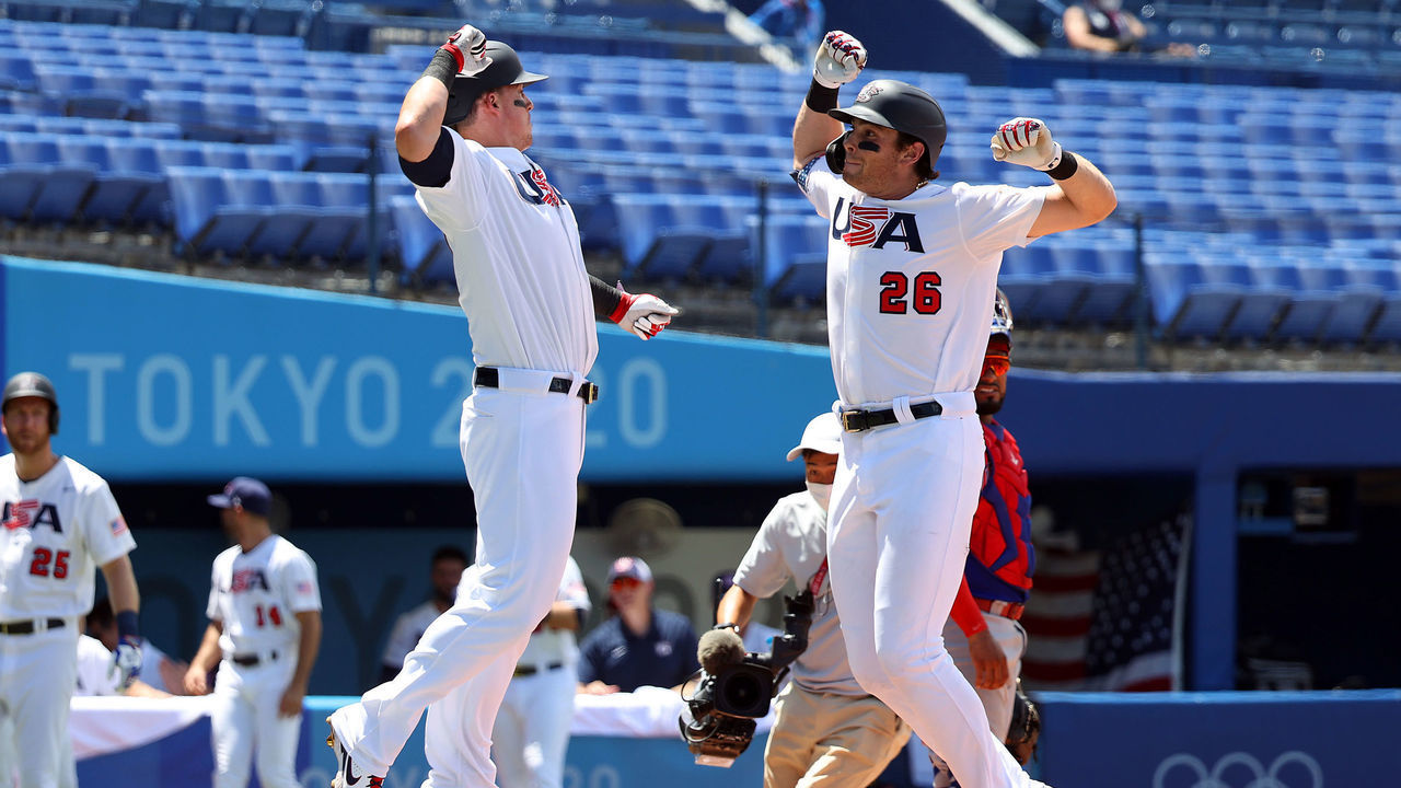 YOKOHAMA, JAPAN - AUGUST 04: Triston Casas #26 and Tyler Austin #23 of Team United States celebrate Casas' two-run home run as catcher Charlie Valerio #7 Team Dominican Republic looks on in the first inning during the knockout stage of men's baseball on day twelve of the Tokyo 2020 Olympic Games at Yokohama Baseball Stadium on August 04, 2021 in Yokohama, Japan.