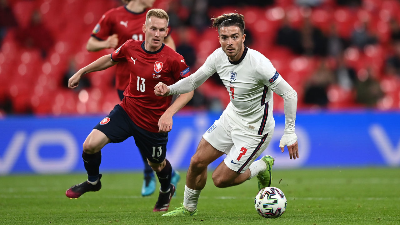 LONDON, ENGLAND - JUNE 22: Jack Grealish of England runs with the ball whilst under pressure from Petr Sevcik of Czech Republic during the UEFA Euro 2020 Championship Group D match between Czech Republic and England at Wembley Stadium on June 22, 2021 in London, England.
