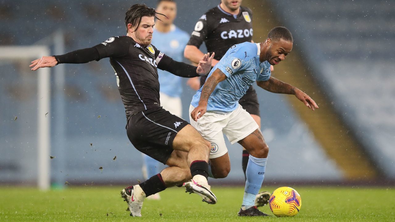 Aston Villa's English midfielder Jack Grealish (L) challenges Manchester City's English midfielder Raheem Sterling (R) during the English Premier League football match between Manchester City and Aston Villa at the Etihad Stadium in Manchester, north west England, on January 20, 2021.