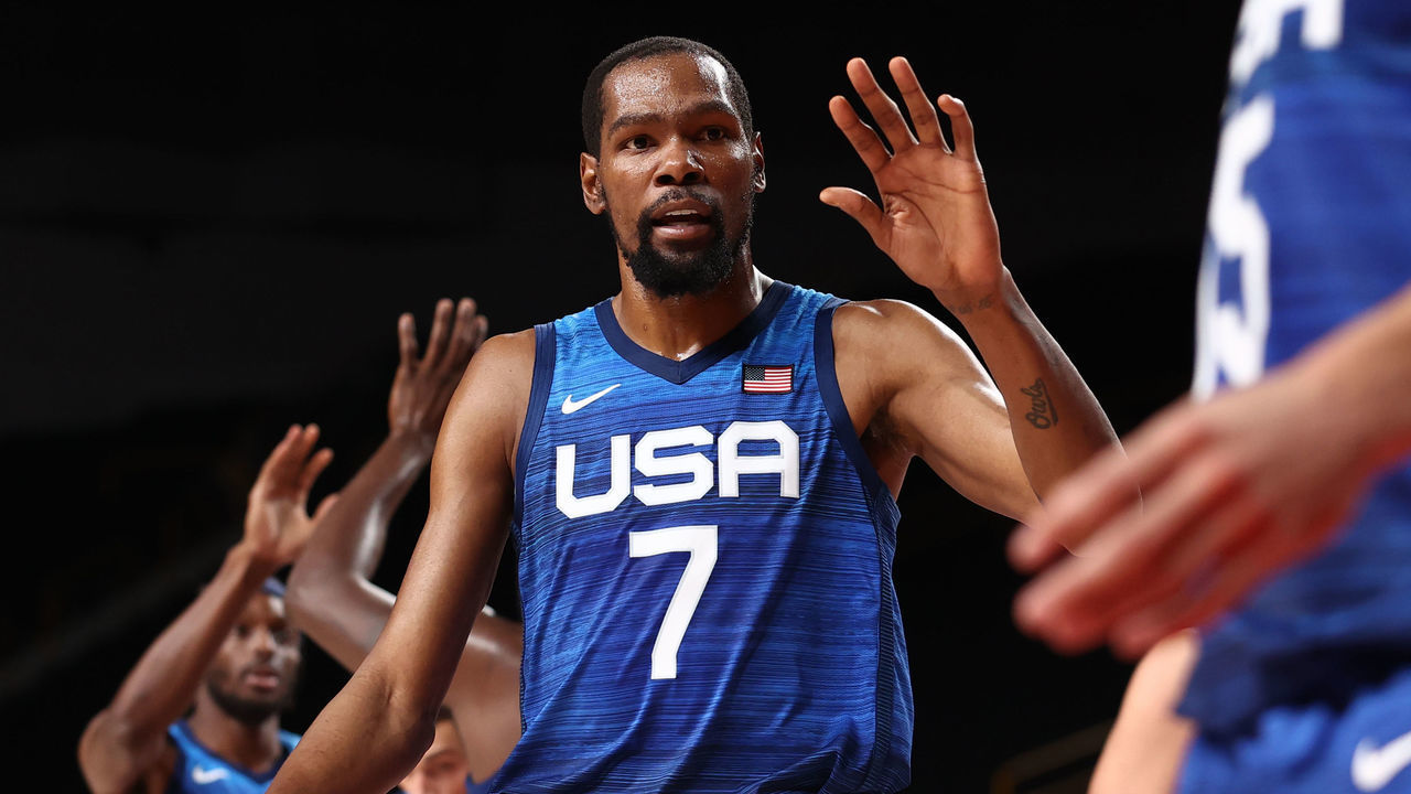 TOKYO, JAPAN - AUGUST 3: Kevin Durant #7 of the USA Men's National Team hi-fives his teammates during the game against the Spain Men's National Team during the 2020 Tokyo Olympics on August 3, 2021 at the Super Saitama Arena in Tokyo, Japan. Mandatory Copyright Notice: Copyright 2021 NBAE