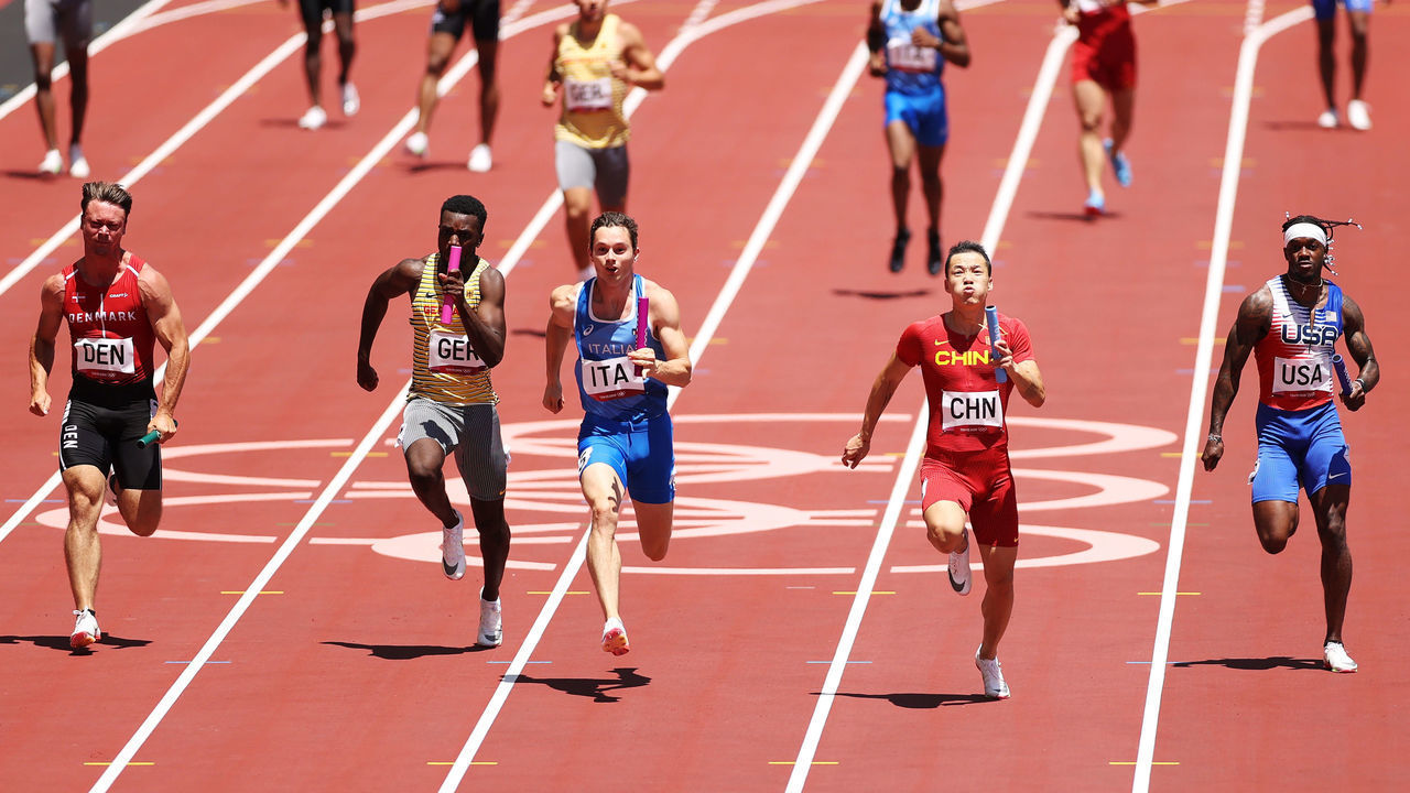 TOKYO, JAPAN - AUGUST 05: Athletes compete in round one of the Men's 4 x 100m Relay heats on day thirteen of the Tokyo 2020 Olympic Games at Olympic Stadium on August 05, 2021 in Tokyo, Japan.