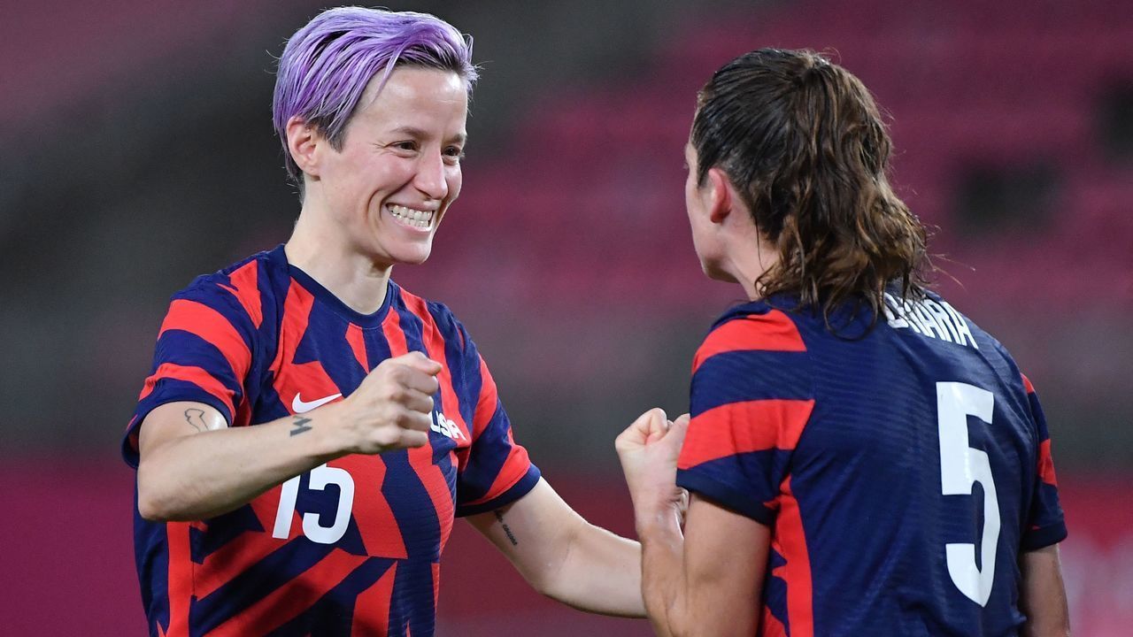 USA's forward Megan Rapinoe (L) celebrates with teammate defender Kelley O'Hara after winning the Tokyo 2020 Olympic Games women's bronze medal football match between Australia and the United States at Ibaraki Kashima Stadium in Kashima city, Ibaraki prefecture on August 5, 2021.