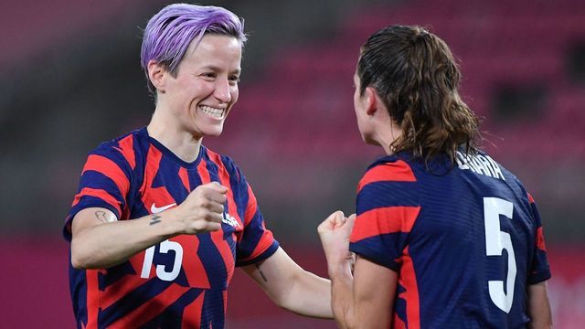 USA's forward Megan Rapinoe (L) celebrates with teammate defender Kelley O'Hara after winning the Tokyo 2020 Olympic Games women's bronze medal football match between Australia and the United States at Ibaraki Kashima Stadium in Kashima city, Ibaraki prefecture on August 5, 2021.