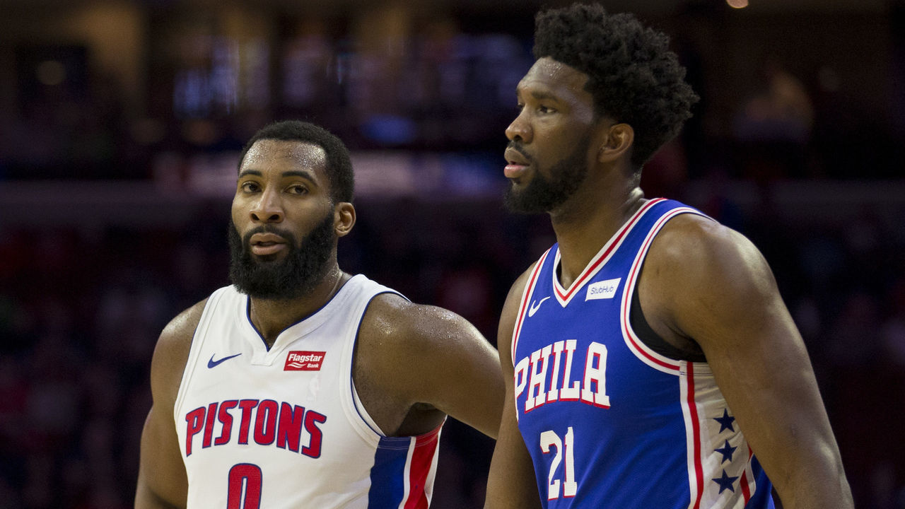 PHILADELPHIA, PA - DECEMBER 10: Andre Drummond #0 of the Detroit Pistons and Joel Embiid #21 of the Philadelphia 76ers look on at the Wells Fargo Center on December 10, 2018 in Philadelphia, Pennsylvania.