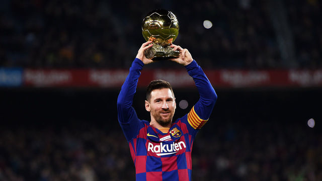 BARCELONA, SPAIN - DECEMBER 07: Lionel Messi of FC Barcelona lifts up his sixth Ballon d'Or prior to the Liga match between FC Barcelona and RCD Mallorca at Camp Nou on December 07, 2019 in Barcelona, Spain.