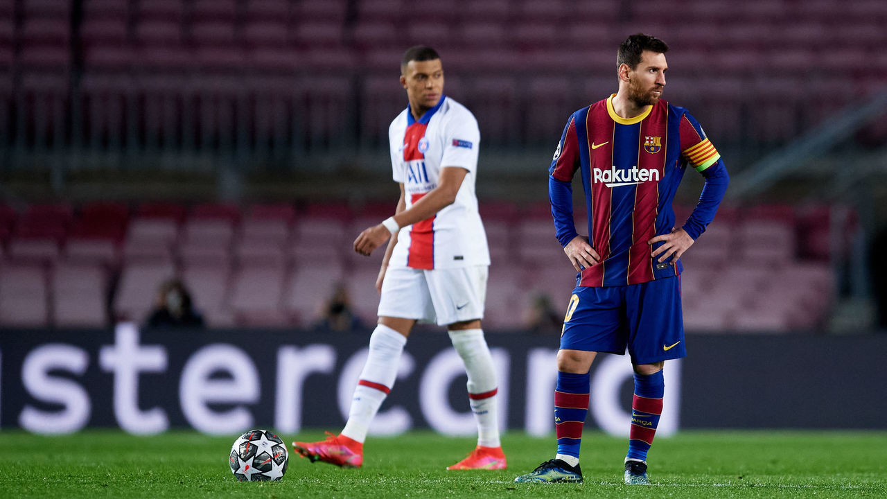 BARCELONA, SPAIN - FEBRUARY 16: Lionel Messi of FC Barcelona looks dejected as Kylian Mbappe of Paris Saint-Germain walks past him after the third goal of Paris Saint-Germain scored by Moise Kean during the UEFA Champions League Round of 16 match between FC Barcelona and Paris Saint-Germain at Camp Nou on February 16, 2021 in Barcelona, Spain. Sporting stadiums around Spain remain under strict restrictions due to the Coronavirus Pandemic as Government social distancing laws prohibit fans inside venues resulting in games being played behind closed doors.