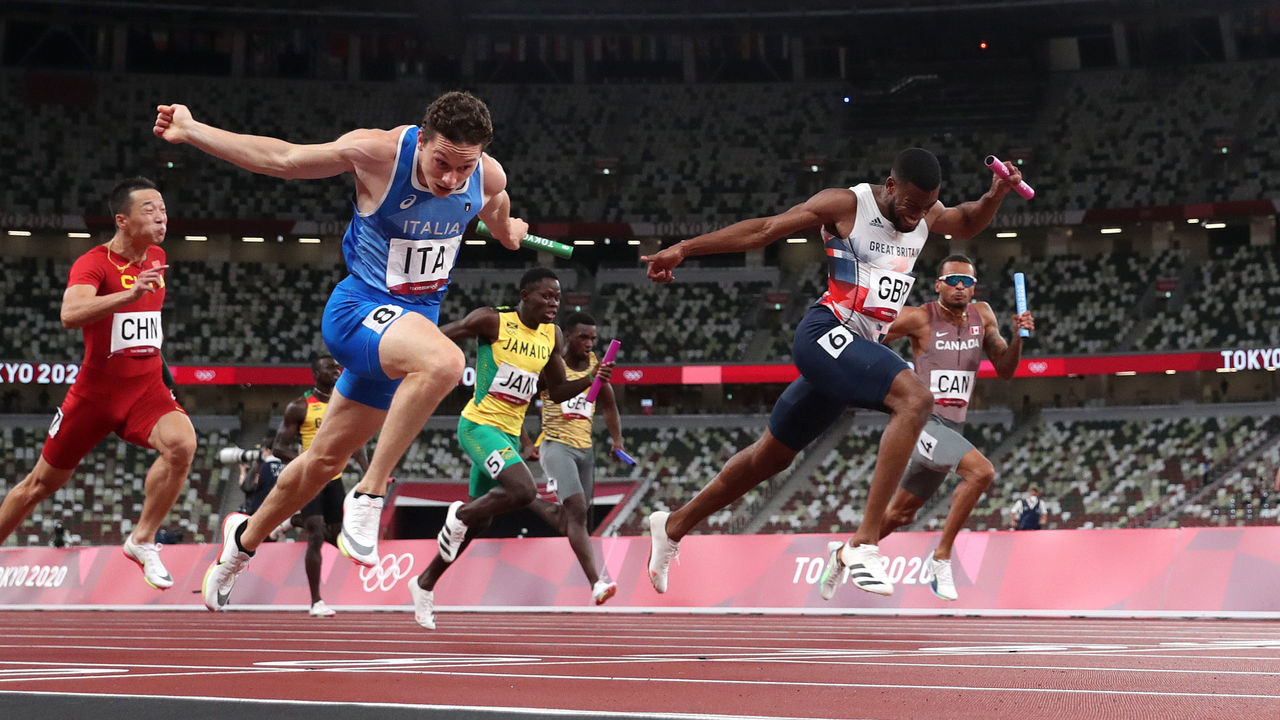 TOKYO, JAPAN - AUGUST 06: Filippo Tortu of Team Italy beats Nethaneel Mitchell-Blake of Team Great Britain across the finish line to win the gold medal in the Men's 4 x 100m Relay Final on day fourteen of the Tokyo 2020 Olympic Games at Olympic Stadium on August 06, 2021 in Tokyo, Japan.