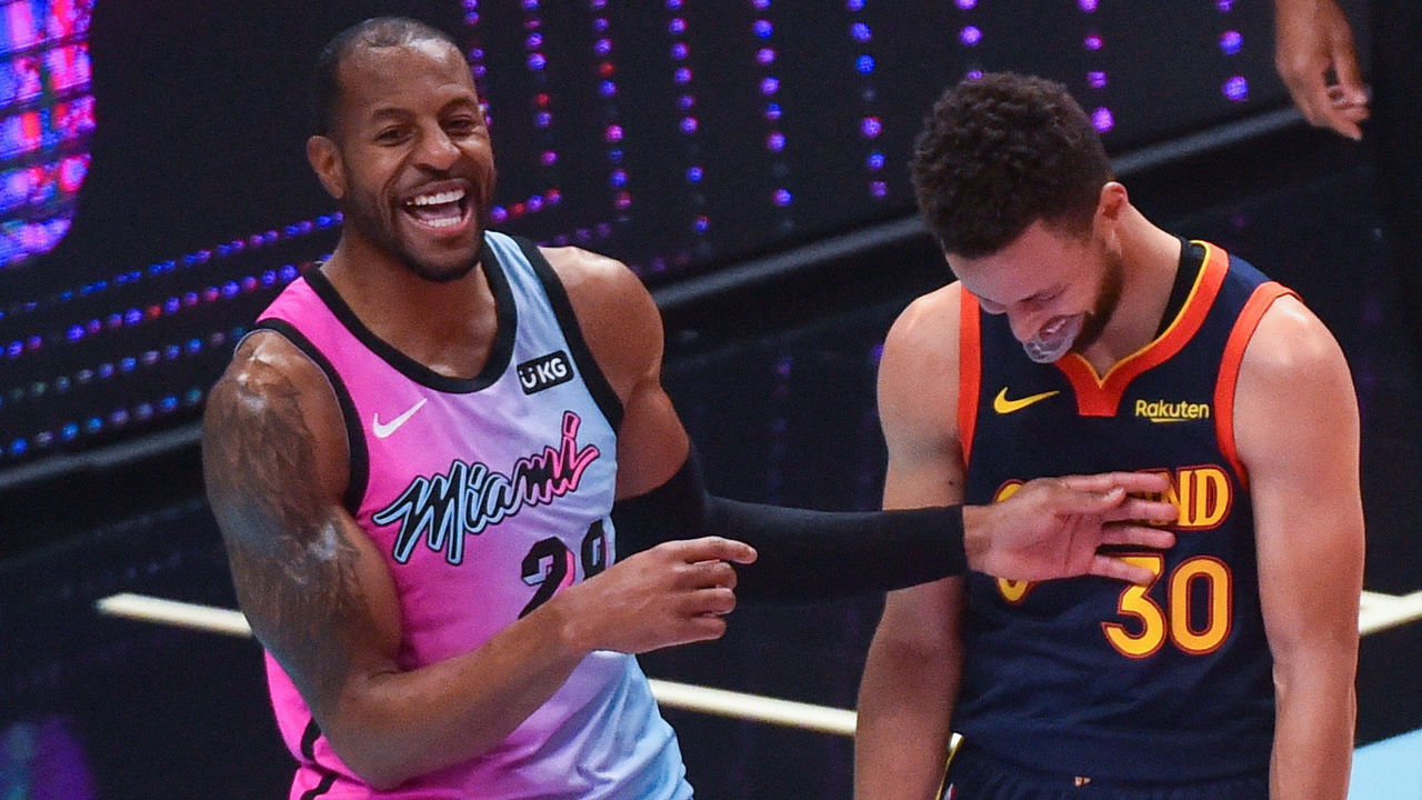 MIAMI, FL - APRIL 01: Andre Iguodala #28 of the Miami Heat and Stephen Curry #30 of the Golden State Warriors share a laugh at the end of the game at the American Airlines Arena on April 1, 2021 in Miami, Florida. NOTE TO USER: User expressly acknowledges and agrees that, by downloading and or using this photograph, User is consenting to the terms and conditions of the Getty Images License Agreement.