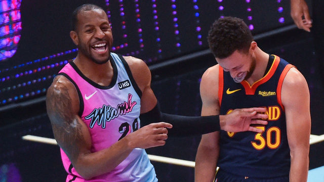 MIAMI, FL - APRIL 01: Andre Iguodala #28 of the Miami Heat and Stephen Curry #30 of the Golden State Warriors share a laugh at the end of the game at the American Airlines Arena on April 1, 2021 in Miami, Florida. NOTE TO USER: User expressly acknowledges and agrees that, by downloading and or using this photograph, User is consenting to the terms and conditions of the Getty Images License Agreement.