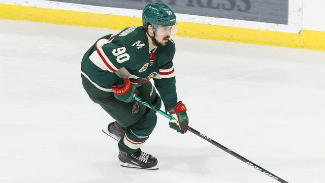 SAINT PAUL, MN - APRIL 5: Marcus Johansson #90 of the Minnesota Wild skates with the puck against the Colorado Avalanche during the game at the Xcel Energy Center on April 5, 2021 in Saint Paul, Minnesota.