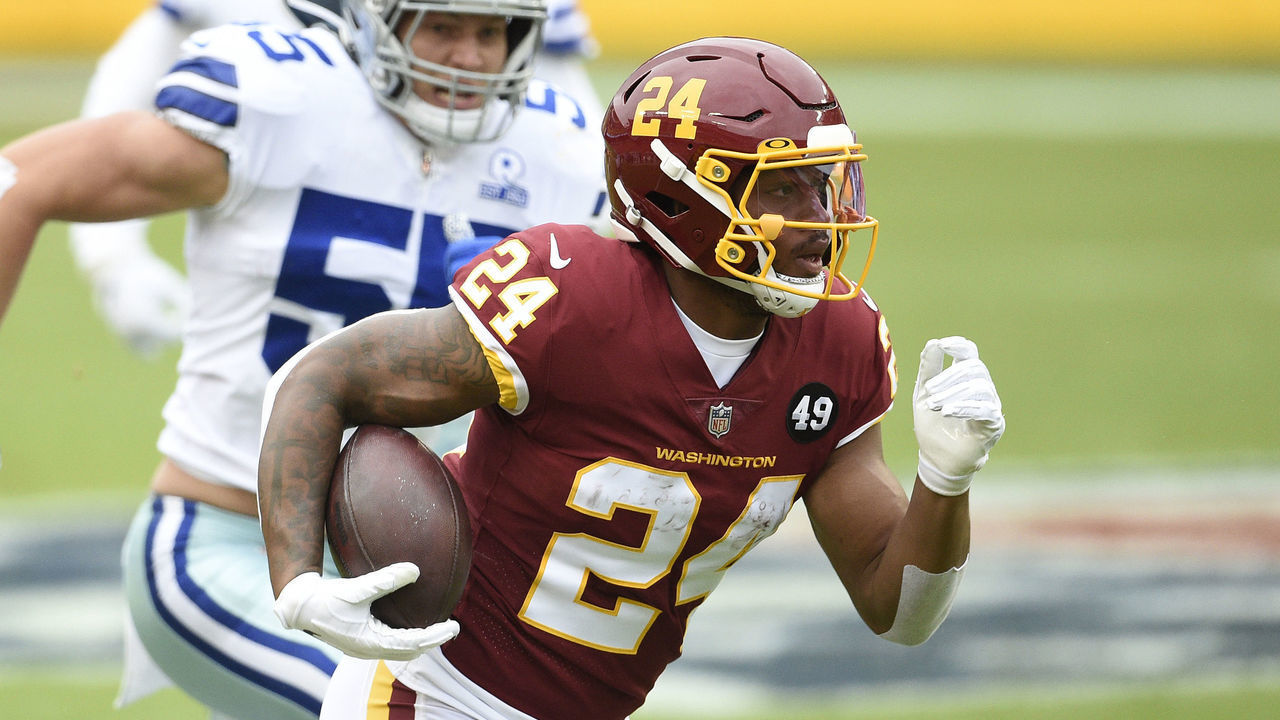 LANDOVER, MARYLAND - OCTOBER 25: Antonio Gibson #24 of the Washington Football Team runs with the ball against the Dallas Cowboys during the first half at FedExField on October 25, 2020 in Landover, Maryland.